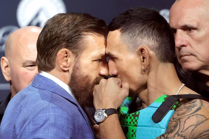 Conor McGregor vs Max Holloway 2 LIVE: Ring walk times tonight for UFC 329 fight as ‘Notorious’ slaps rival during face-off